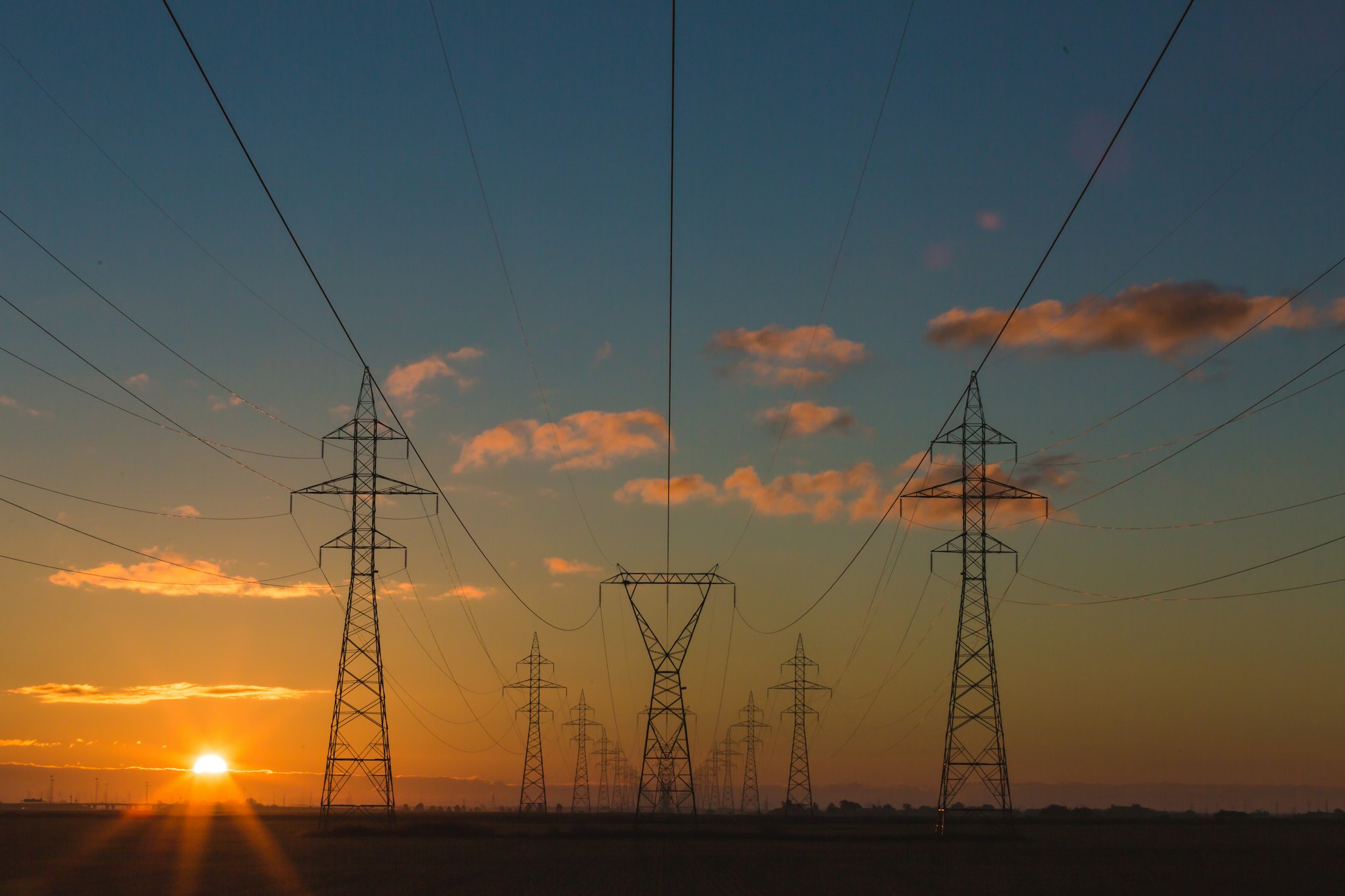 Energy transmission lines at dusk